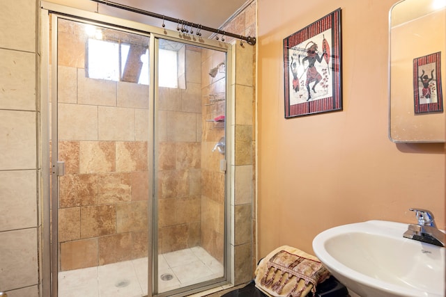 full bathroom with a sink and a shower stall