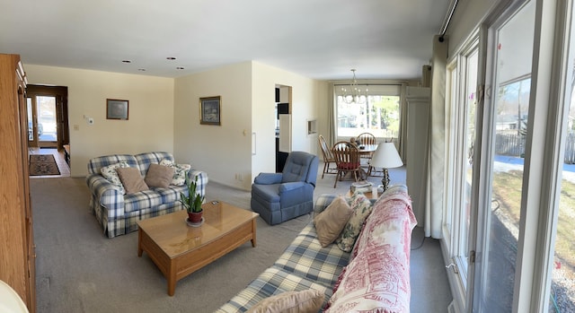 living room featuring carpet floors and a healthy amount of sunlight