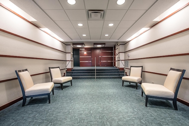 lobby with visible vents and stairway