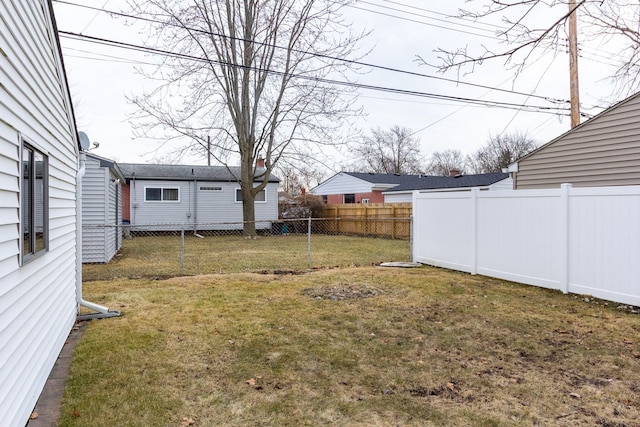 view of yard with a fenced backyard