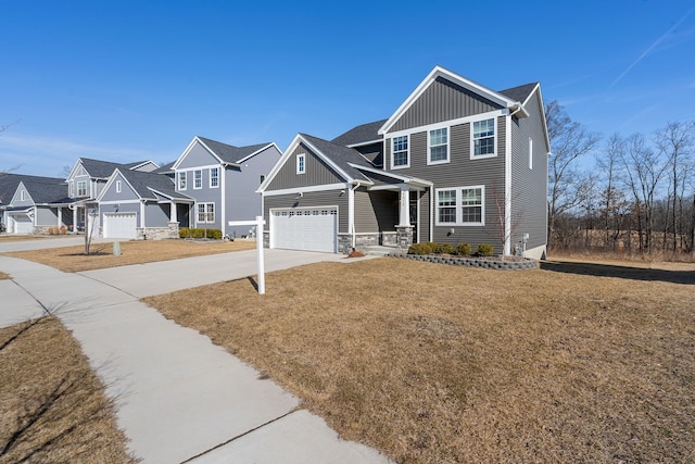 craftsman inspired home featuring driveway, a residential view, board and batten siding, an attached garage, and a front yard