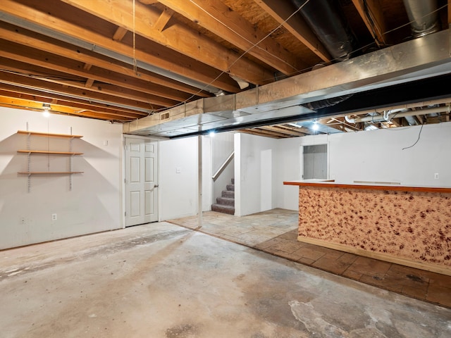 unfinished basement with stairs