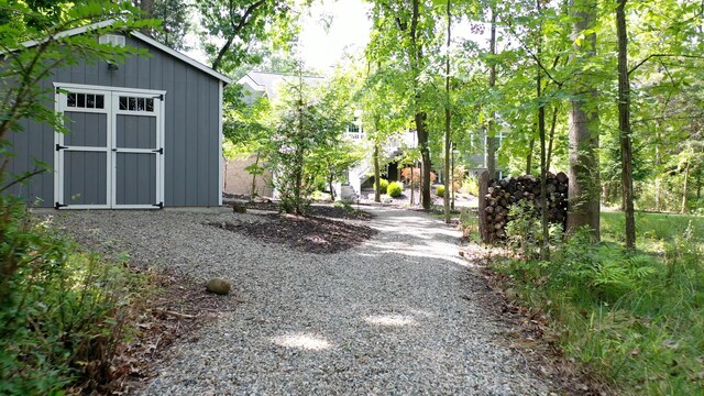 exterior space featuring an outbuilding and a storage unit