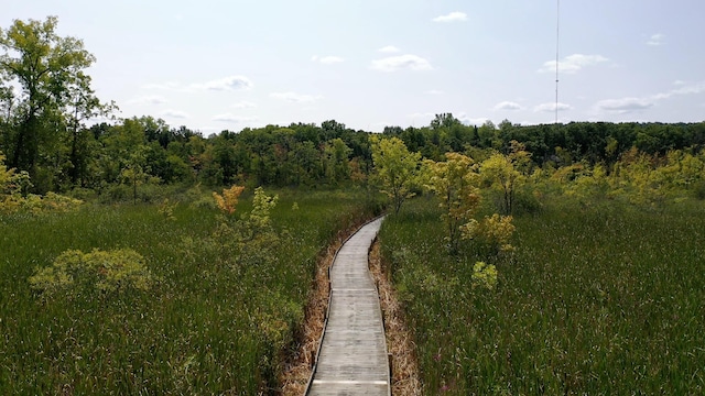 exterior space featuring a forest view