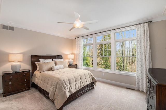 bedroom featuring ornamental molding, visible vents, and light colored carpet