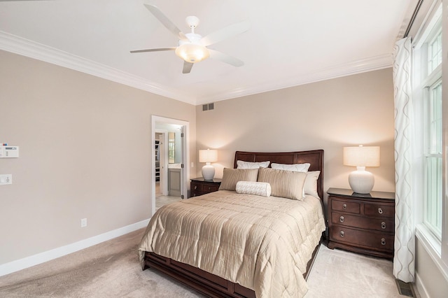 bedroom with visible vents, crown molding, and light colored carpet