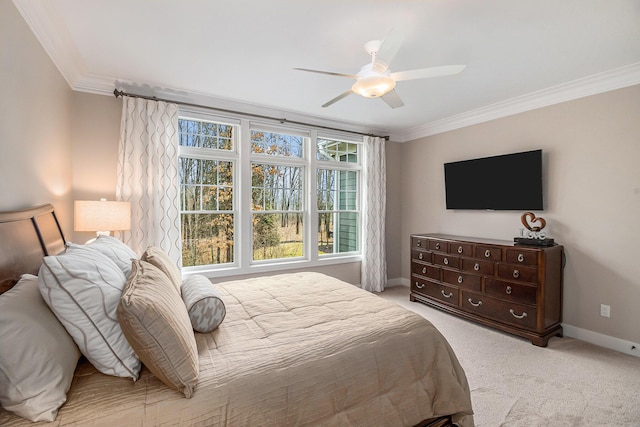 bedroom featuring baseboards, ceiling fan, carpet flooring, and crown molding