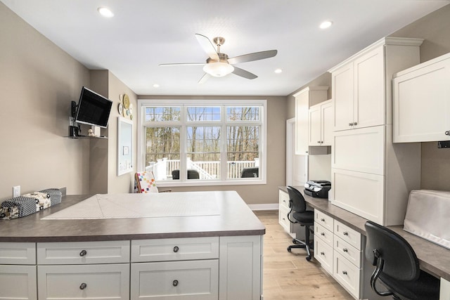 kitchen featuring a ceiling fan, dark countertops, light wood-type flooring, white cabinetry, and recessed lighting