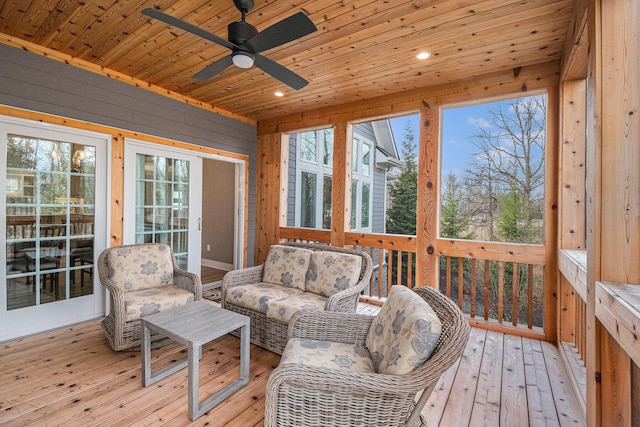 sunroom with wooden ceiling and a ceiling fan