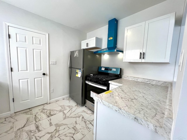 kitchen with white cabinets, marble finish floor, appliances with stainless steel finishes, and extractor fan