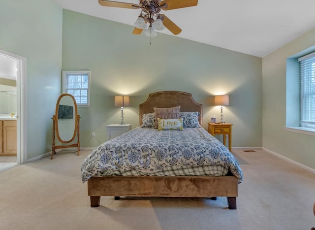 bedroom featuring carpet flooring, multiple windows, and vaulted ceiling