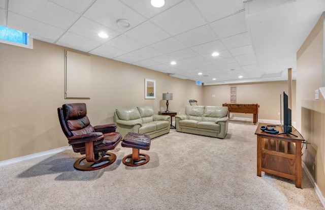 living room with recessed lighting, carpet, baseboards, and a paneled ceiling