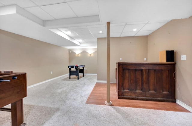 game room with a drop ceiling, baseboards, and carpet flooring