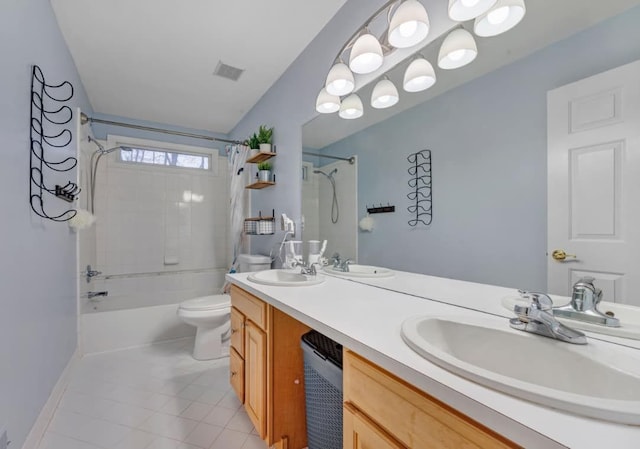 full bathroom featuring tile patterned floors, toilet, shower / bath combo, and a sink