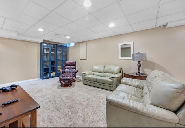 living room with recessed lighting, baseboards, a paneled ceiling, and carpet