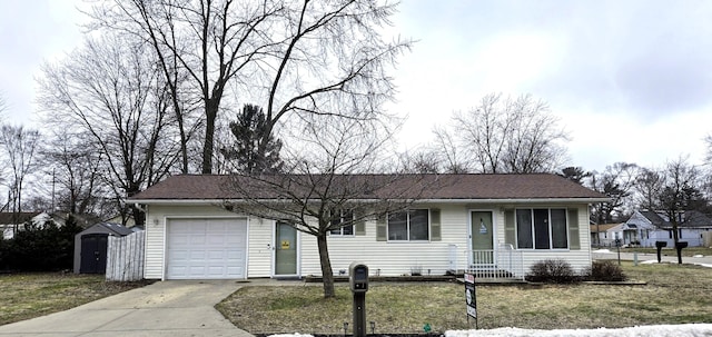 ranch-style house with an attached garage, driveway, a shingled roof, and a front yard