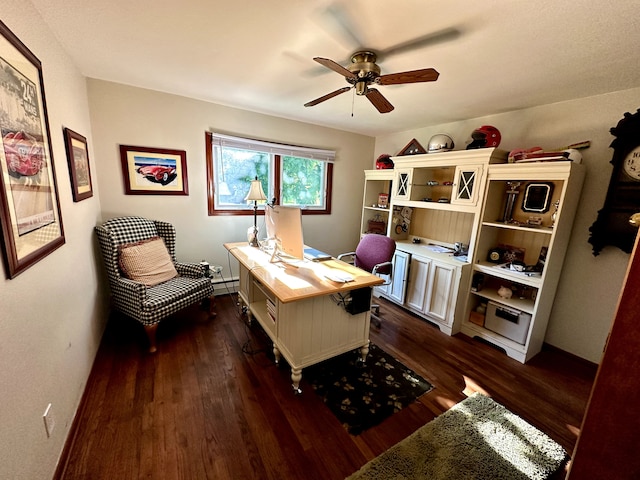 office space featuring a ceiling fan, baseboards, a baseboard heating unit, and dark wood-type flooring