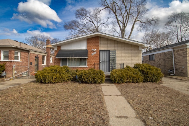 view of front of property featuring brick siding