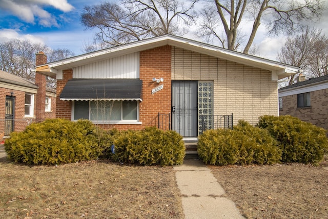 entrance to property with brick siding