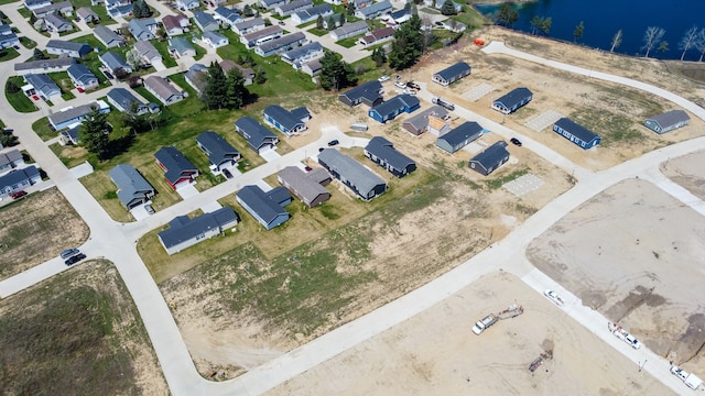 bird's eye view with a residential view and a water view