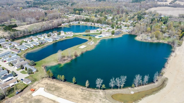 drone / aerial view featuring a water view and a residential view