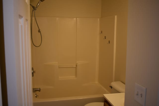 bathroom featuring shower / bath combination, vanity, and toilet