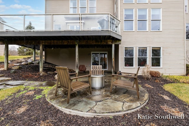 back of house featuring a patio and a wooden deck