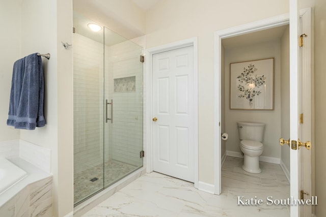 bathroom with a garden tub, toilet, baseboards, marble finish floor, and a shower stall