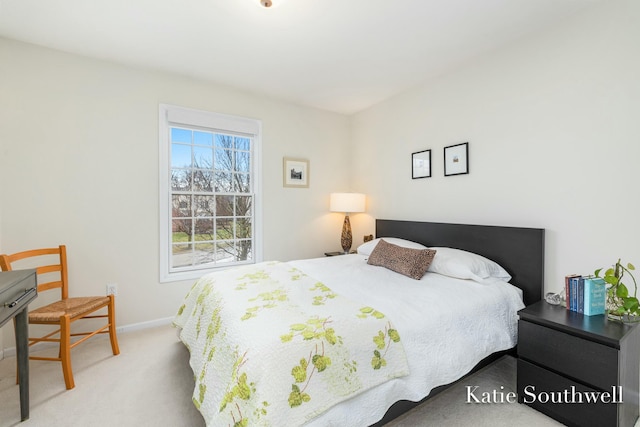 bedroom featuring carpet and baseboards