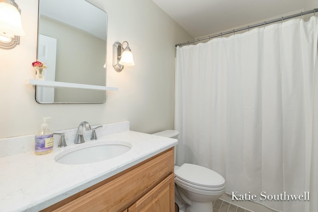 bathroom with toilet and vanity