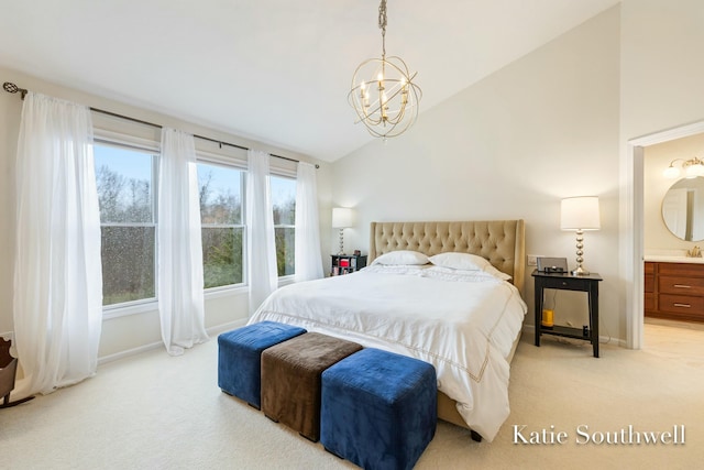 bedroom featuring baseboards, light colored carpet, ensuite bathroom, an inviting chandelier, and vaulted ceiling