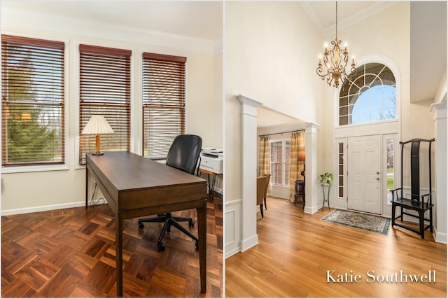 home office with crown molding, ornate columns, a high ceiling, an inviting chandelier, and baseboards