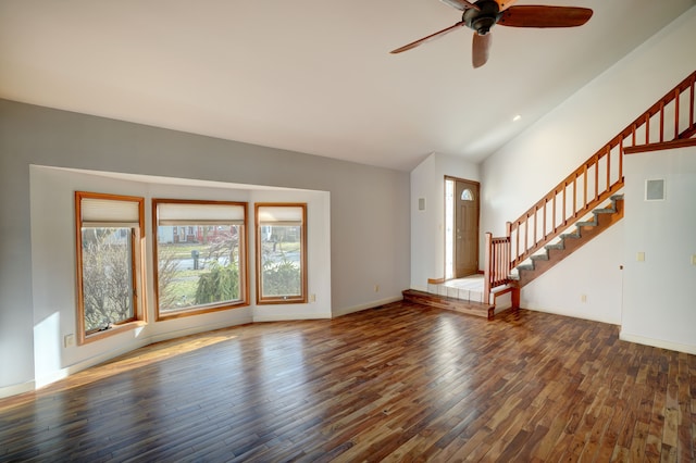 unfurnished living room with visible vents, baseboards, stairs, vaulted ceiling, and hardwood / wood-style floors