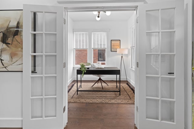 office space featuring dark wood-style floors and baseboards