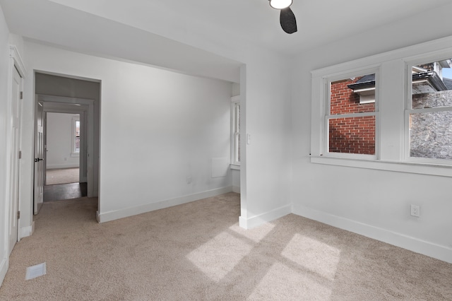 unfurnished bedroom featuring carpet flooring and baseboards