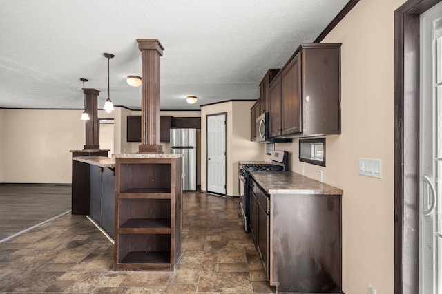 kitchen featuring dark brown cabinets, appliances with stainless steel finishes, open shelves, stone finish floor, and ornate columns