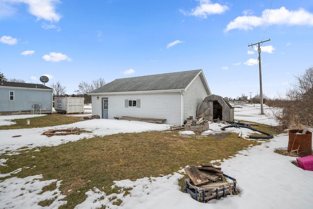 view of front of home featuring an outbuilding