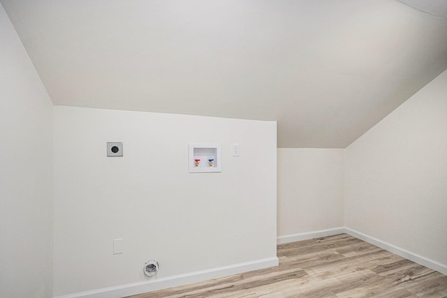 laundry room featuring baseboards, washer hookup, laundry area, light wood-style flooring, and electric dryer hookup