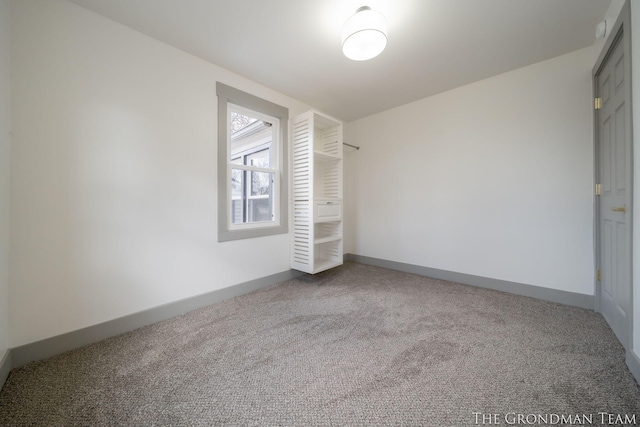 unfurnished bedroom with carpet and baseboards