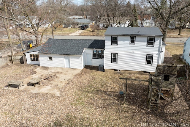 back of house with fence and central air condition unit