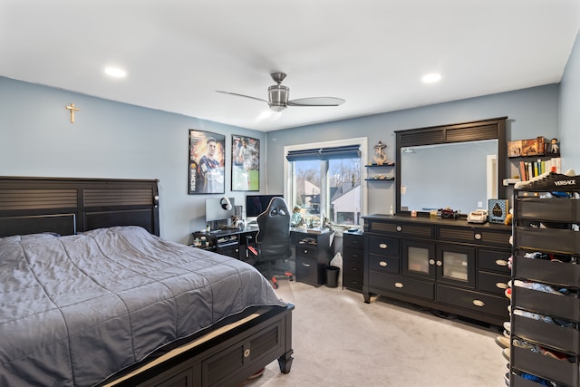 bedroom featuring a ceiling fan and light colored carpet