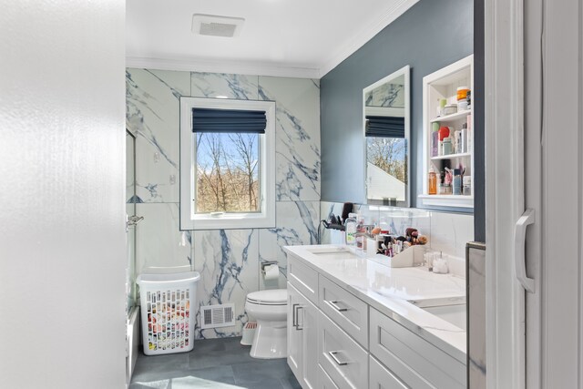 bathroom featuring vanity, visible vents, ornamental molding, tile walls, and toilet