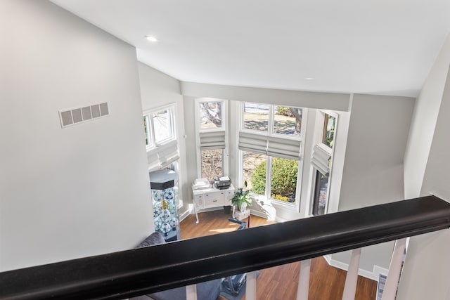 room details featuring visible vents, recessed lighting, baseboards, and wood finished floors