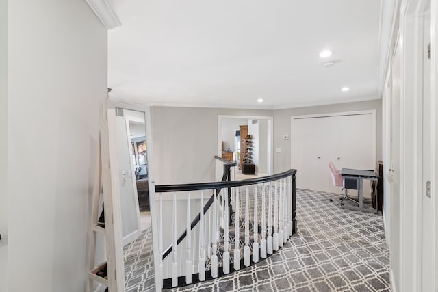 corridor featuring an upstairs landing, recessed lighting, crown molding, and carpet