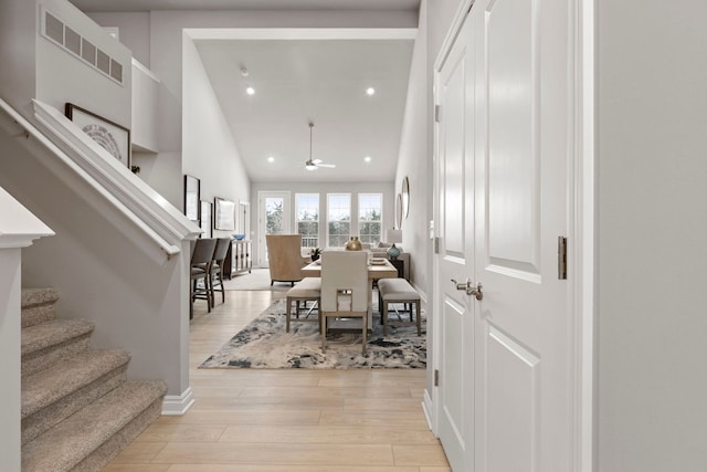 dining area featuring visible vents, light wood-style flooring, stairs, recessed lighting, and a ceiling fan