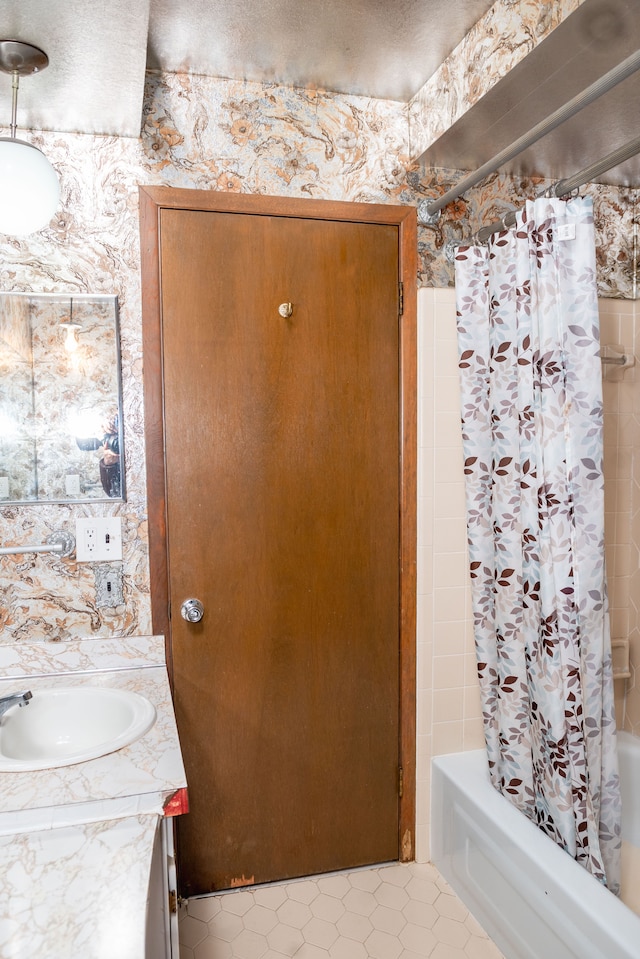 bathroom featuring vanity and shower / tub combo with curtain