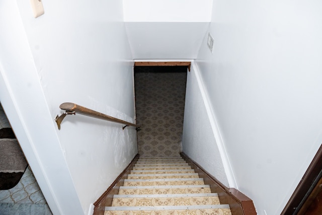 stairway featuring visible vents