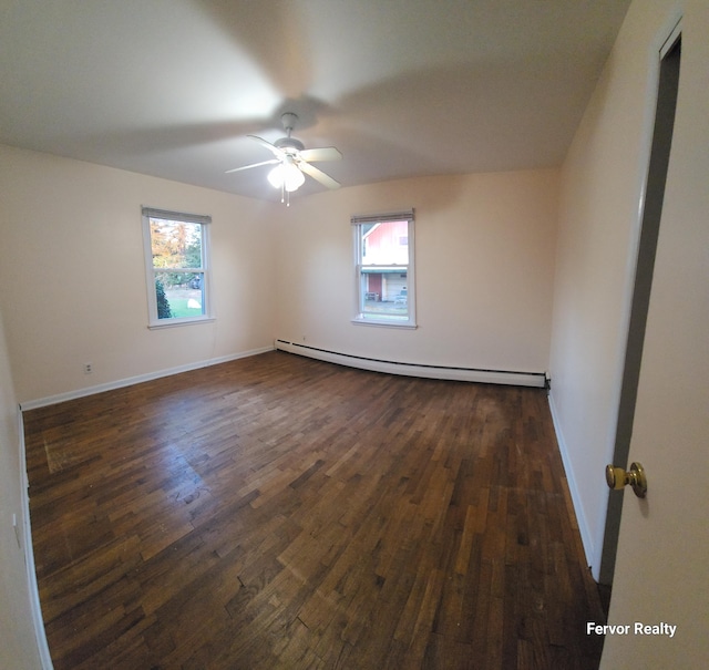 bonus room featuring a baseboard radiator, baseboards, ceiling fan, and dark wood-type flooring