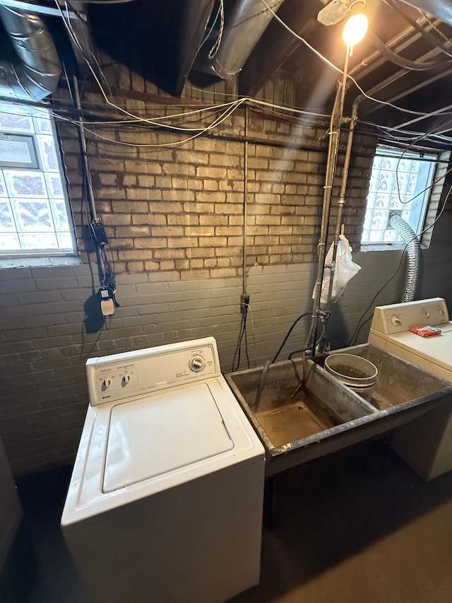 clothes washing area with laundry area and washer / dryer