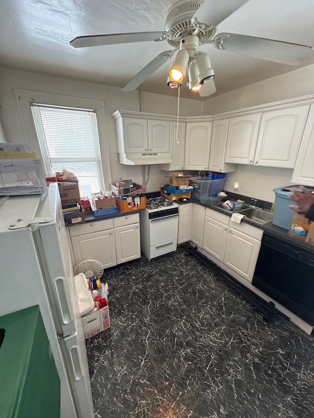 kitchen featuring under cabinet range hood, dark countertops, white appliances, white cabinets, and ceiling fan